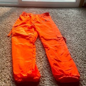 Orange joggers size M.